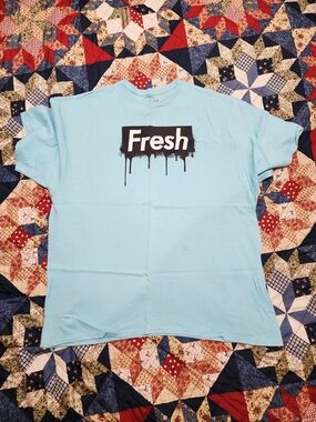 Popular Poison Light Blue Graphic Tee with Black 'Fresh' Drip Logo